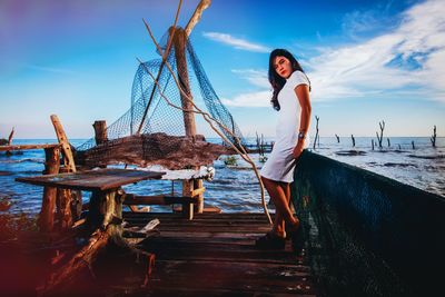 Full length of woman standing on pier