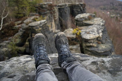 Low section of person on rock