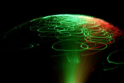 Close-up of light painting against black background