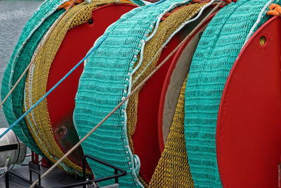 Rolled up fishing nets at harbor