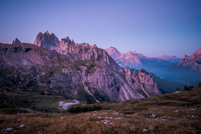 Scenic view of mountains against clear blue sky