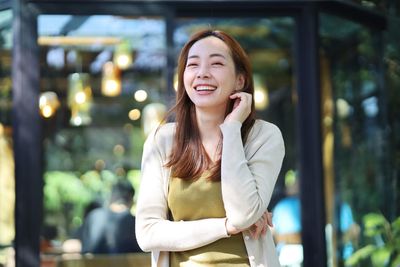 Portrait of young woman looking away