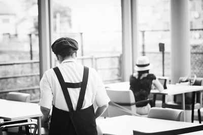 Rear view of waitress at restaurant