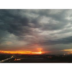 Scenic view of cloudy sky at sunset