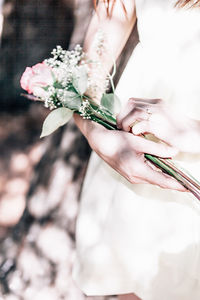 Close-up of woman holding bouquet