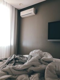 High angle view of crumpled blankets on bed at home