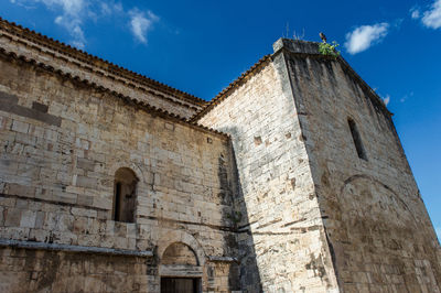 Low angle view of old building against sky