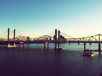 View of bridge in city against clear sky