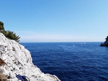 Scenic view of sea against blue sky