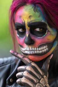 Close-up of woman with face paint