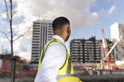 Engineer in reflective clothing at construction site