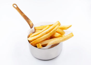 High angle view of bread and fries against white background