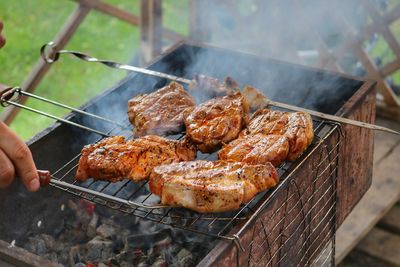 Close-up of meat on barbecue grill