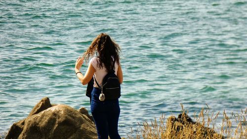 Rear view of woman looking at sea