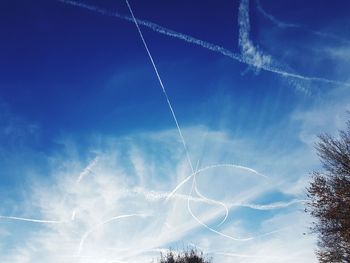 Low angle view of vapor trails in sky