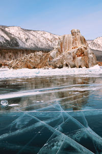 Scenic view of frozen lake against sky