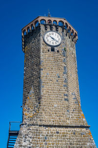 The ancient clock tower, symbol of the ancient village of marta, on the shore of the bolsena lake 