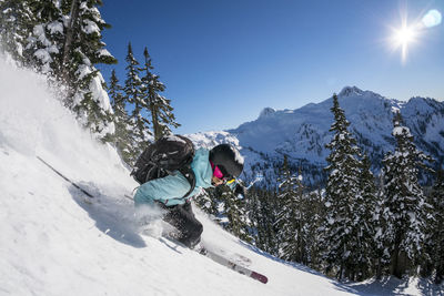 Woman skiing in backcountry at mt. baker, washington