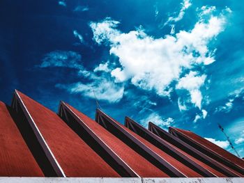 Low angle view of roof and building against sky