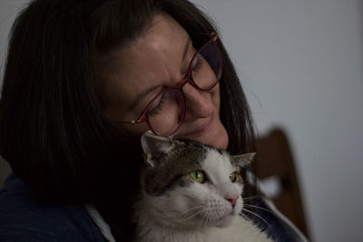 Portrait of woman with cat