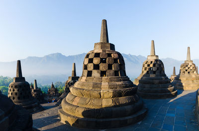 Stupas of building against clear sky