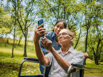 Woman photographing with mobile phone