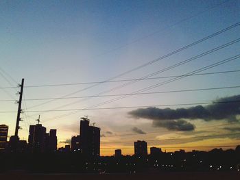 Silhouette of city at sunset