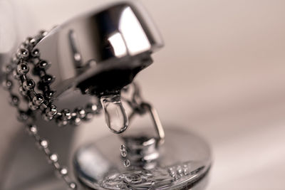 Close-up of water drops on metal