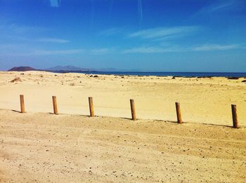 Scenic view of landscape against blue sky