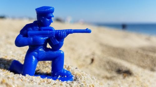 Close-up of toy on beach