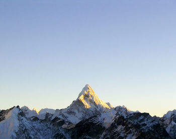 Snow capped peak ama dablam in the himalaya, nepal.