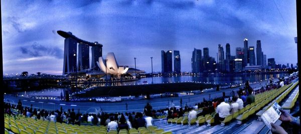 View of cityscape against cloudy sky