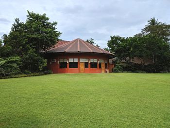 House on field against sky