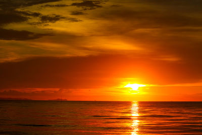 Scenic view of sea against romantic sky at sunset