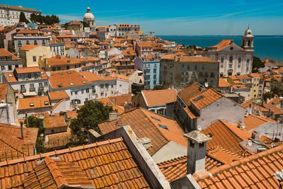 Lisbon skyline rooftop view on a sunny summer day with traditonal orange 