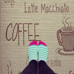 Low section of man standing on tiled floor