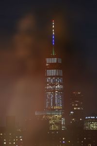 View of skyscrapers lit up at night