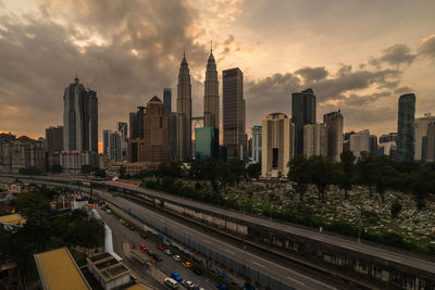 Panoramic view of city buildings against sky during sunset