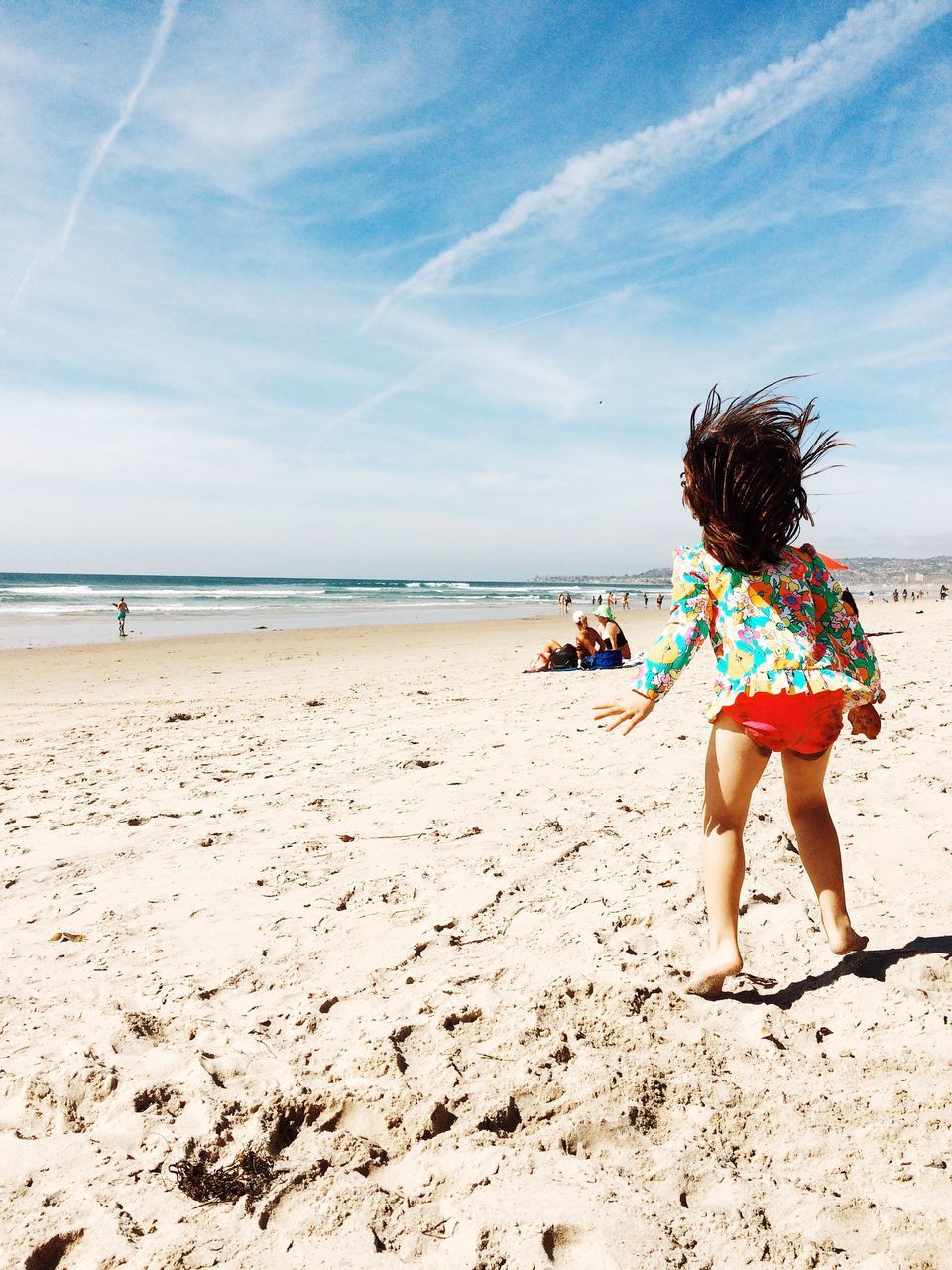 beach, sea, sand, shore, leisure activity, horizon over water, lifestyles, sky, water, full length, vacations, childhood, rear view, person, girls, casual clothing, beauty in nature, weekend activities