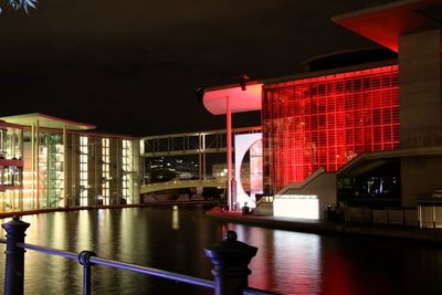 Illuminated buildings in city at night