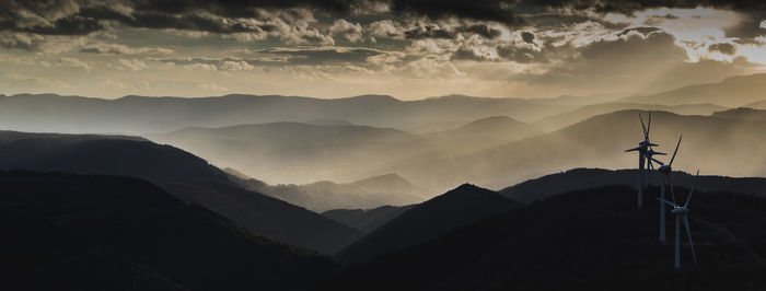 Scenic view of mountains against sky during sunset