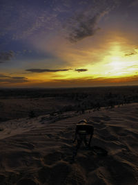 Scenic view of beach against sky during sunset