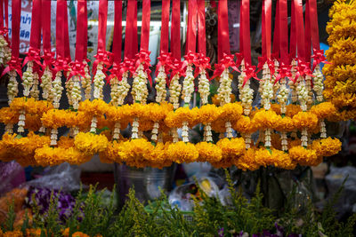 Close-up of yellow flowers hanging in market