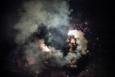 View of firework display against sky at night