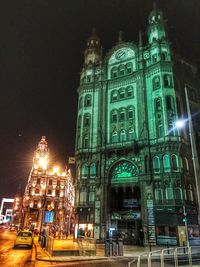 Low angle view of illuminated building at night