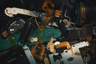 High angle view of machine parts on table