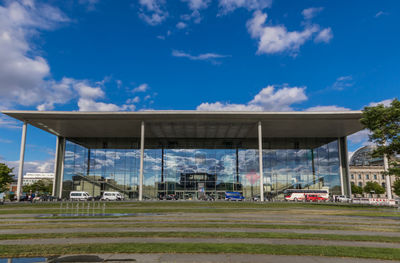 Built structure on field against blue sky