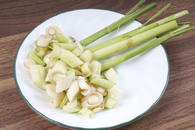 High angle view of chopped vegetables in plate on table