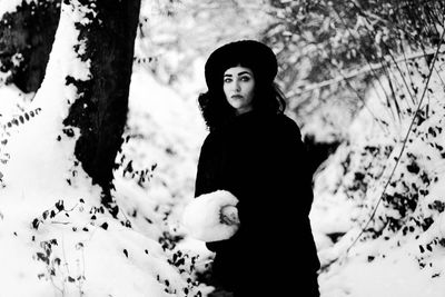 Portrait of young woman in snow