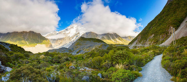 Panoramic view of river amidst mountains against sky